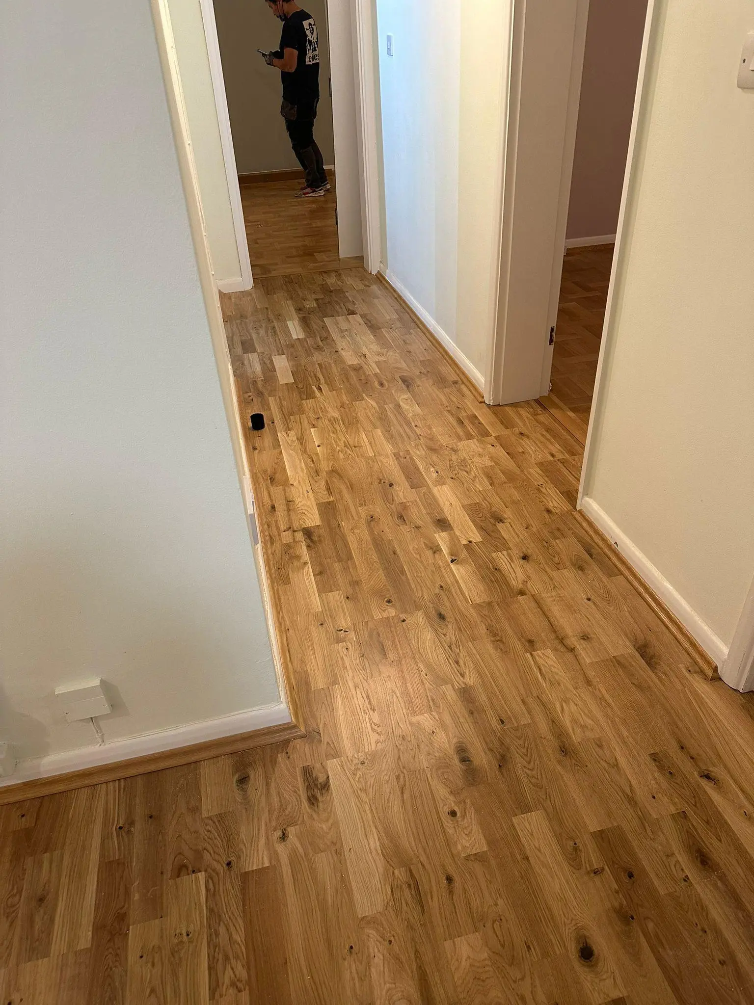 Oak strip wood flooring running through a hallway
